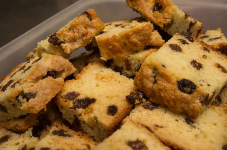 Raisin bread in a storage container, ready to take to a friend's house to share.の写真素材