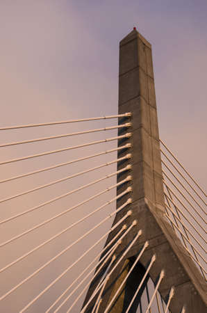 One of the towers of the Zakim Bridge in Boston, with the cables leading down to the road deck.の写真素材
