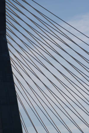 One of the towers of the Zakim Bridge in Boston, with the cables leading down to the road deck.の写真素材