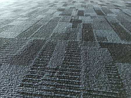 Blue color fabric background. Dark blue office carpet pattern interior.