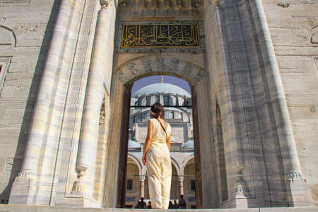 Woman at the gate of Suleymaniye Mosque in Istanbul, Turkeyの写真素材
