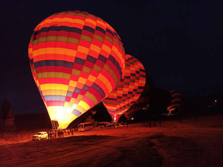 Hot air balloons preparing to fly at early morning in winter season in Cappadocia, Turkeyのeditorial素材
