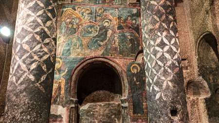 Gumusler Monastery from inside. Sacred Frescos on the wall of the Cave Church in Cappadociaのeditorial素材
