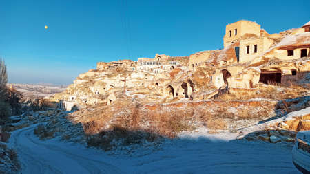 Ancient stone cave houses carved into the volcanic rock in Cappadocia, Turkeyのeditorial素材