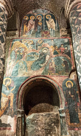Gumusler Monastery from inside. Sacred Frescos on the wall of the Cave Church in Cappadociaのeditorial素材