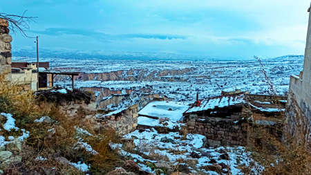 Ancient stone cave houses carved into the volcanic rock in Cappadocia, Turkeyのeditorial素材