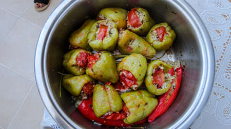 Close-up view of Traditional Turkish cuisine Stuffed Peppers (Biber Dolmasi) in a metal pan. Stuffed meat and rice in green peppersの写真素材