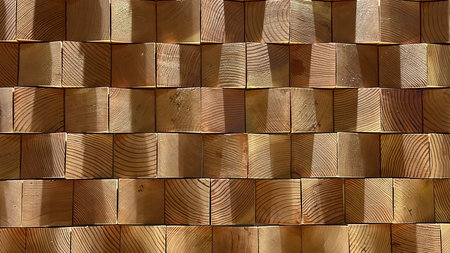 Wooden wall made of logs in the sun. Abstract background.