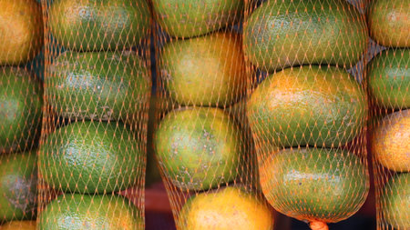 Orange fruit in the market, closeup of citrus fruit background.の写真素材
