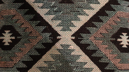 Texture, background, pattern. The fabric is knitted with a pattern of multi-colored threads.