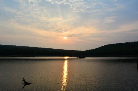 Sky sunset behind the mountainsの写真素材
