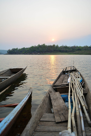 Rowing boats moored on the riverの写真素材