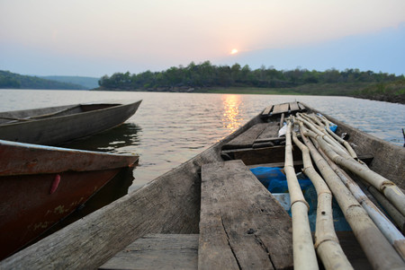 Rowing boats moored on the riverの写真素材