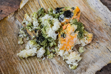 Rotten moldy rice and put on dry banana leavesの写真素材