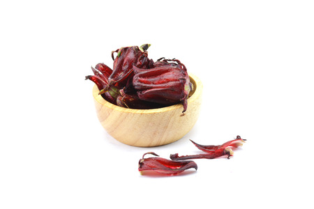 Roselle fruit red in wood bowl on white backgroundの写真素材