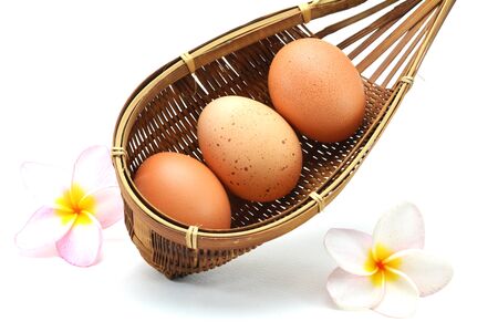Fresh eggs on white backgroundの写真素材