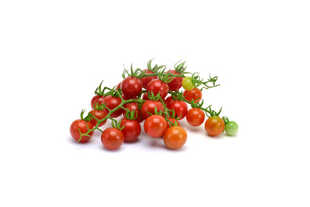 fresh tomatoes with green leaves isolated on white backgroundの写真素材