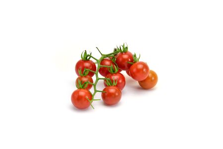 fresh tomatoes with green leaves isolated on white backgroundの写真素材