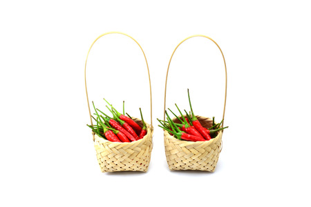 Red chili pepper isolated in baketon a white backgroundの写真素材