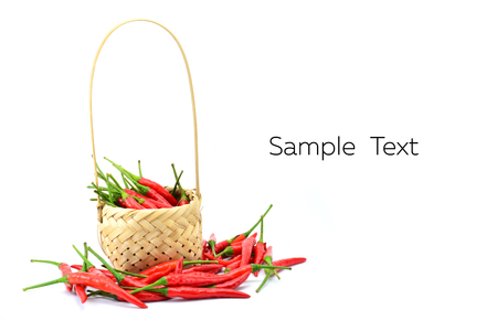 Red chili pepper isolated in baketon a white backgroundの写真素材