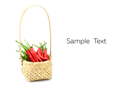 Red chili pepper isolated in baketon a white backgroundの写真素材