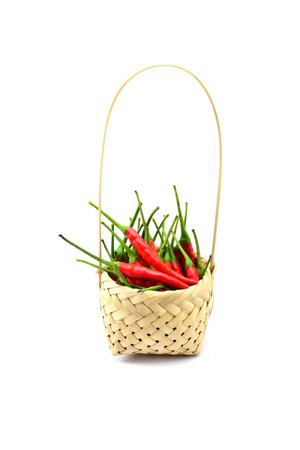 Red chili pepper isolated in baketon a white backgroundの写真素材