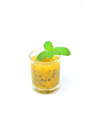 Passion fruit juice on white backgroundの写真素材