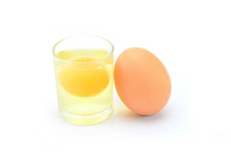 Fresh egg in a glassの写真素材