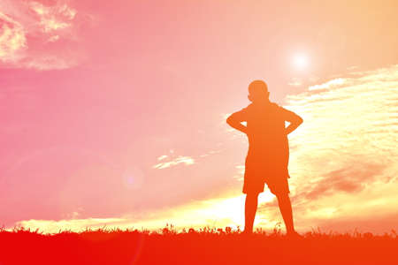 silhouettes a boy at sunset. Concept big dreamの写真素材