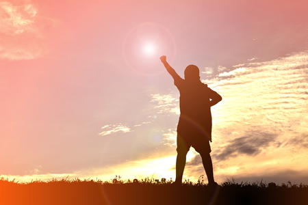 silhouettes a boy at sunset. Concept big dreamの写真素材
