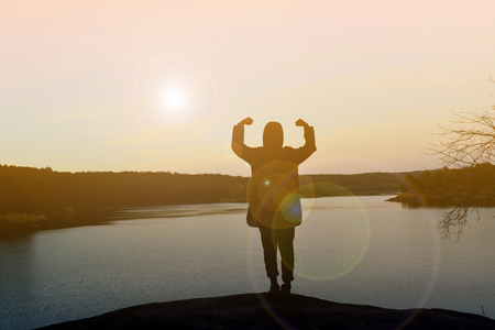 Silhouette happy women on sunriseの写真素材
