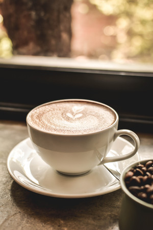 hot coffee latte art in coffee shop.selective and soft focusの写真素材