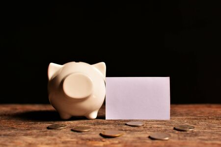 piggy bank with money on black background. Concept dream bigの写真素材