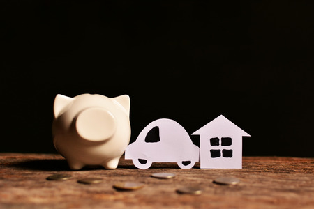 piggy bank with money on black background. Concept dream bigの写真素材