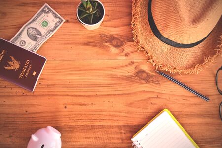 Thai passport and hat on wood background .Concept travelの写真素材