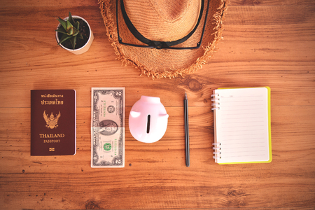 Thai passport and hat on wood background .Concept travelの写真素材