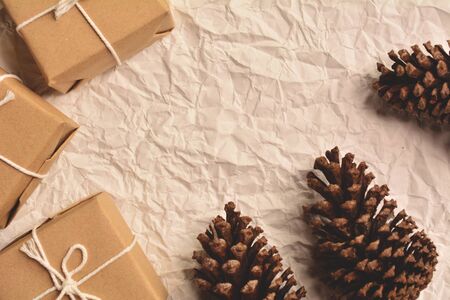 pine cones and gift on old wood,christmas concept. Soft focus