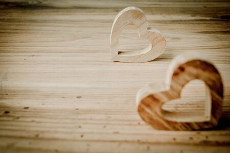 beautiful heart shape wood on wood background ,vintage tone and soft focus,concept valentine dayの写真素材