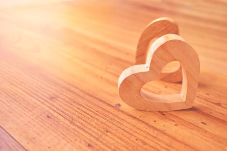 beautiful heart shape wood on wood background ,vintage tone and soft focus,concept valentine dayの写真素材
