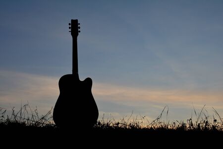 Silhouette guitar at the sky sunset, color of vintage toneの写真素材