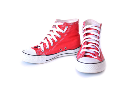 Red sneakers on white backgroundの写真素材