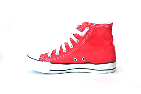 Red sneakers on white backgroundの写真素材