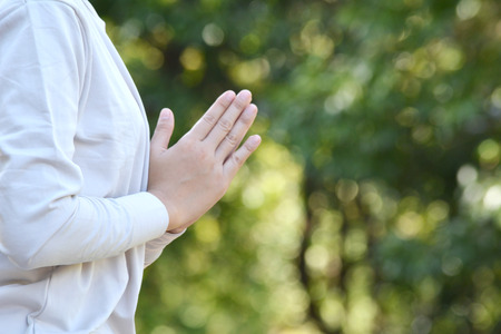 Women yoga in nature near river, color of vintage tone selective and soft focusの写真素材