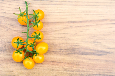 Hipster tone Top view group of tomato on old wood background, selective and soft focusの写真素材