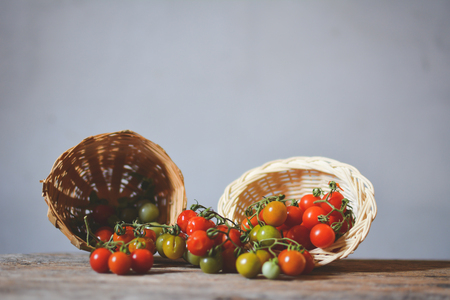 Still life group of tomato on old woodの写真素材