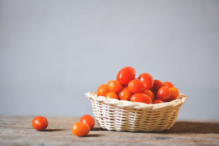 Still life group of tomato on old woodの写真素材