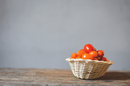 Still life group of tomato on old woodの写真素材