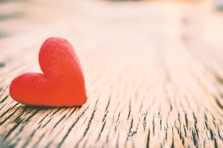 Valentine day red heart on old wood ,Hipster tone and soft focusの写真素材