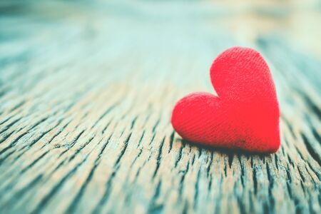 Valentine day red heart on old wood ,Hipster tone and soft focusの写真素材