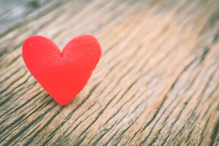 Valentine day red heart on old wood ,Hipster tone and soft focusの写真素材